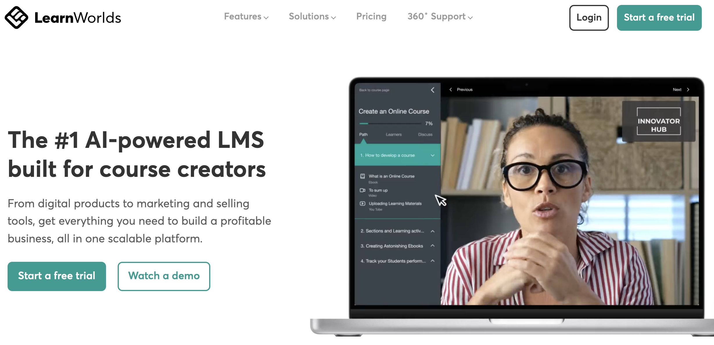 LearnWorlds homepage highlighting its AI-powered LMS for course creators, featuring a video instructor and course creation interface on a laptop screen.